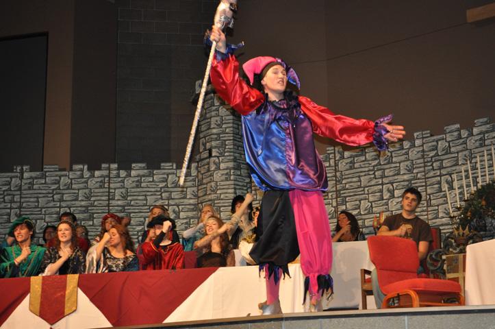 The jester, played by senior Jacob Gehrke, raises his arms to speak to the audience at the dress rehearsal on Nov. 27.