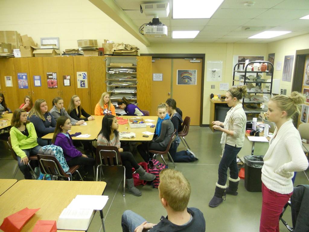 Marena Black (left) and Meredith Johnson (right), two leaders of Oasis speak to the group on Nov 28. Oasis meets every Wednesday before and after school.