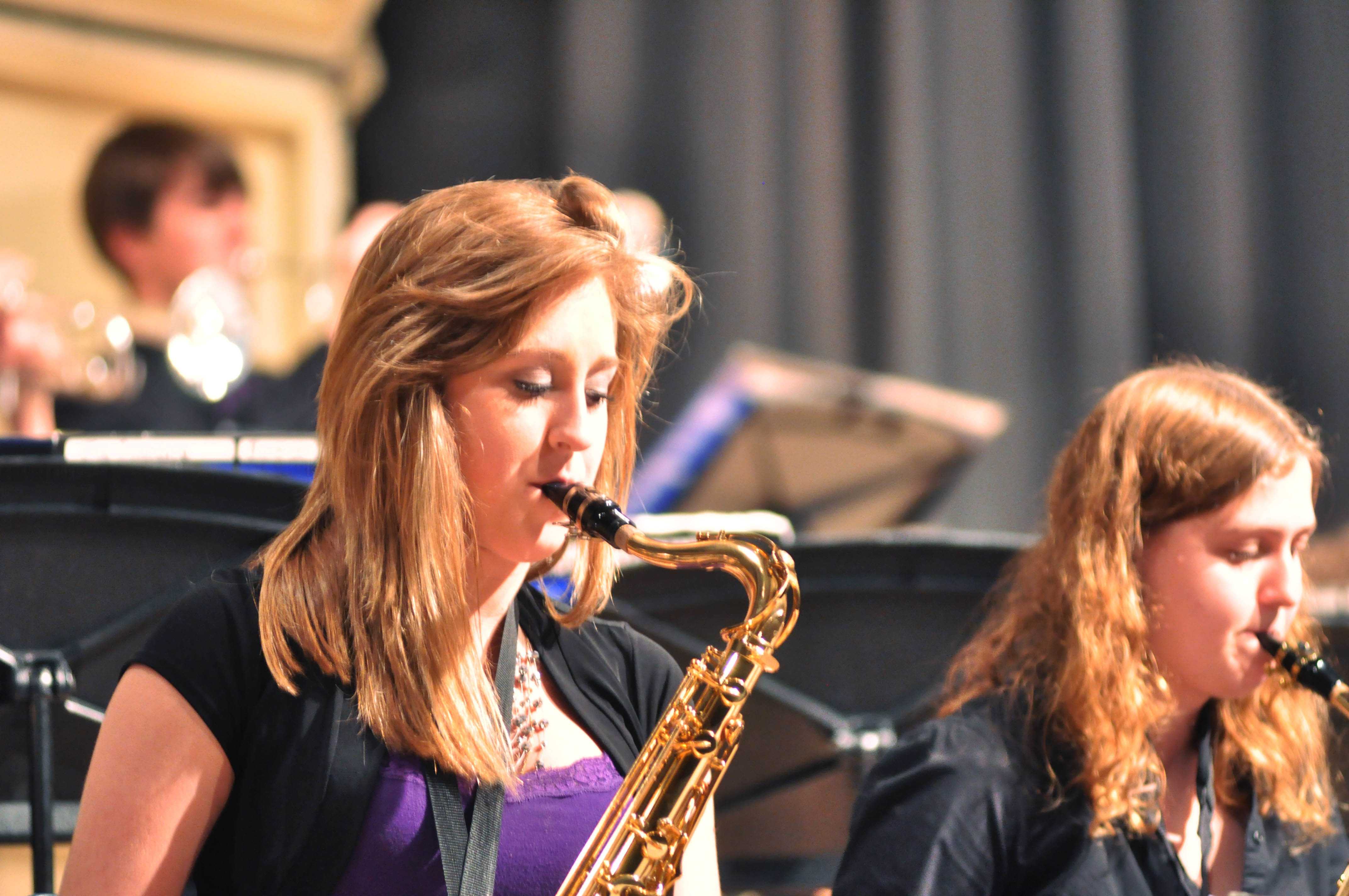 Junior Samantha Long and senior Leanna McAllister perform during Jazz Syndicates set. While Long plays the alto sax normally in concert band, she takes up a tenor sax for jazz band.