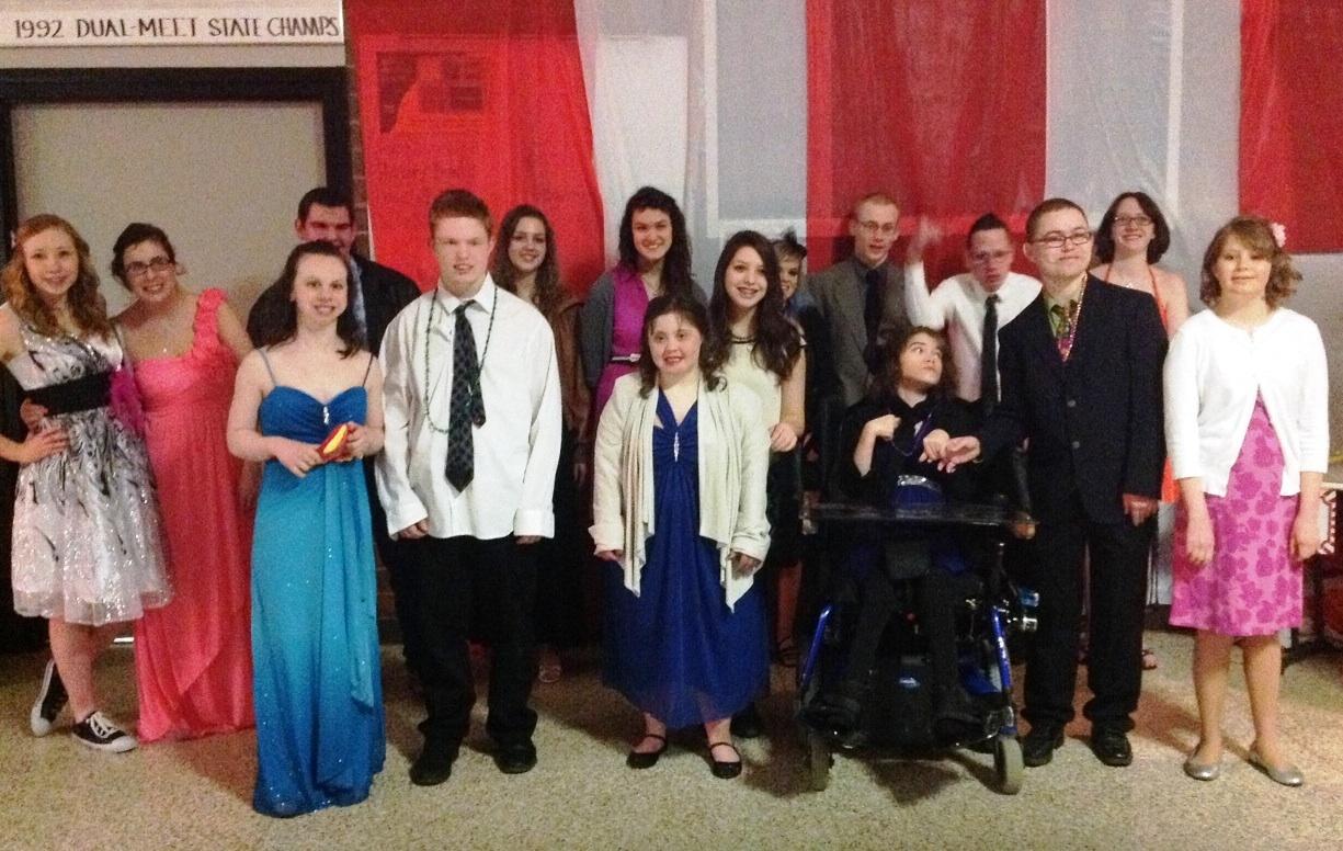 Students attending Best Buddies prom gather for a group picture. The prom was held at Dowling High School on Sat. March 9. Prom was fantastic this year, Best Buddies president Callie Coulter said. The theme was A Night at the Carnival, so there was dancing, games, and carnival-themed food.
