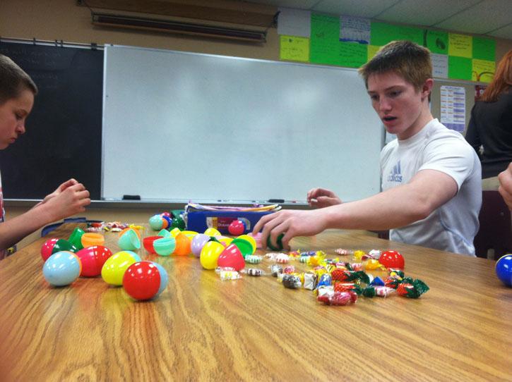 Students+stuff+eggs+for+District+Egg+Hunt