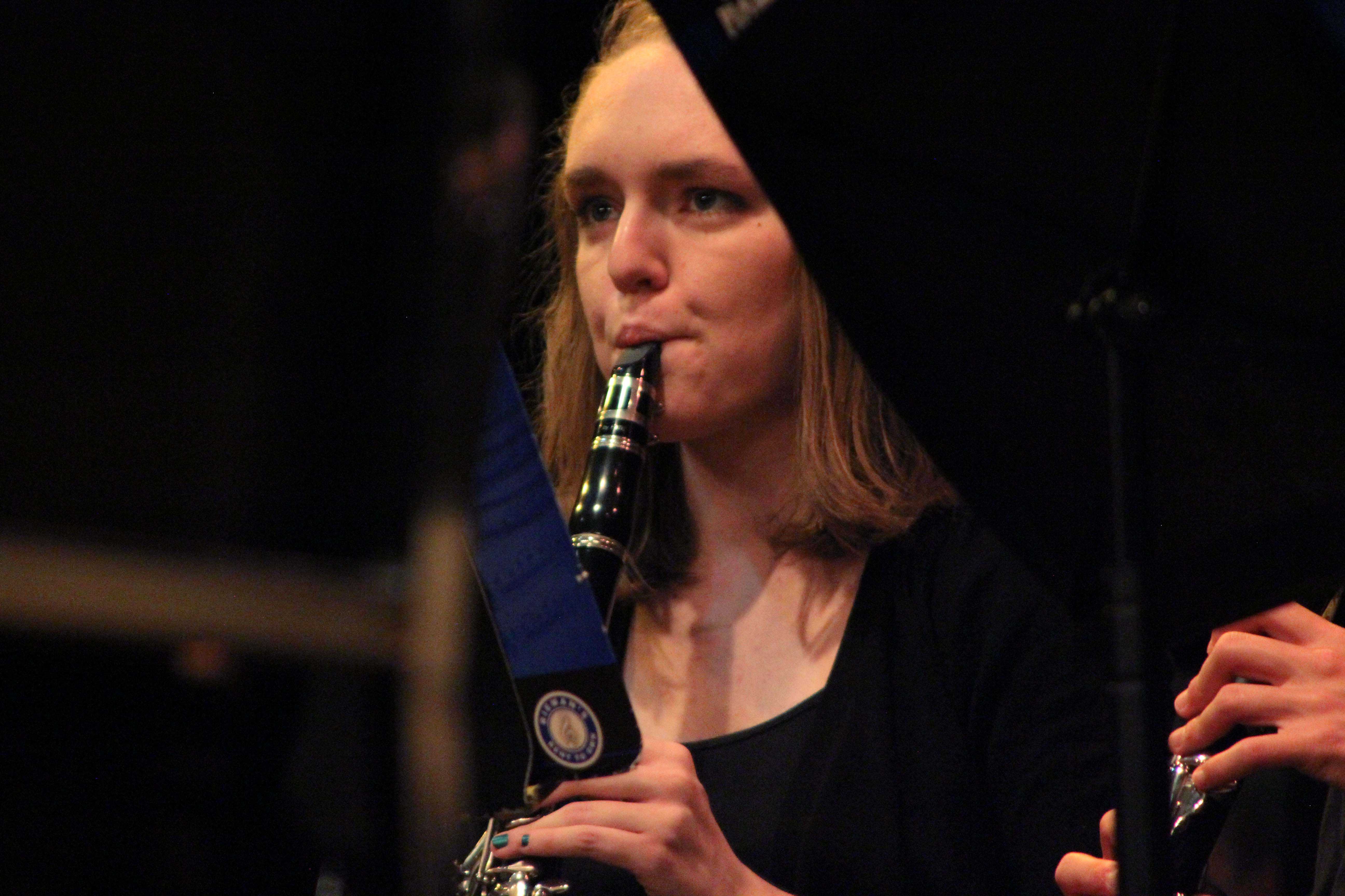 Junior Abby Dockum plays clarinet along with the wind symphony during their spring concert on May 7.