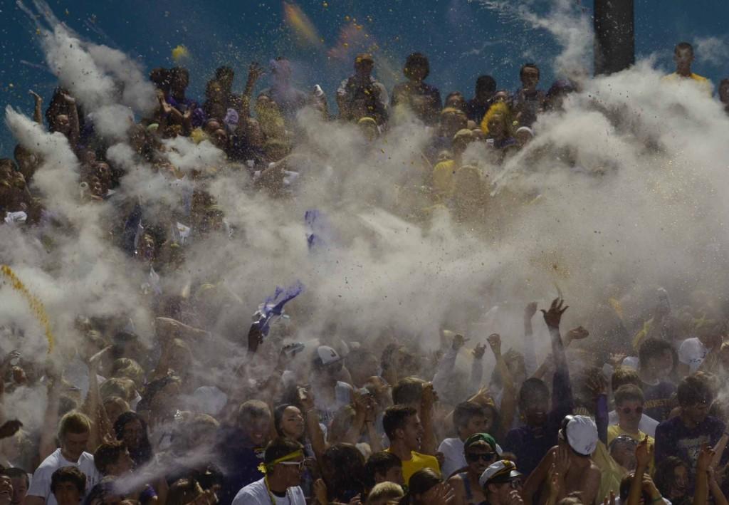 Students+throw+powder+at+homecoming+game.+The+students+planned+to+throw+purple+powder%2C+but+administration+took+most+of+the+powder+away.+