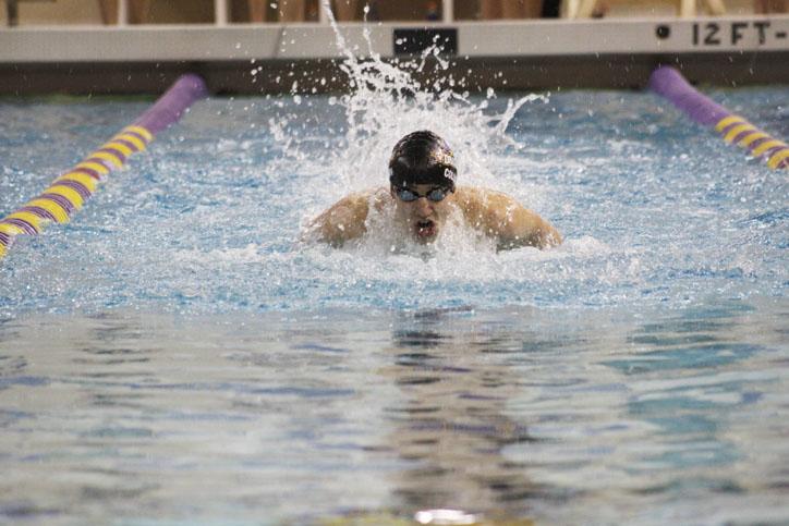 Junior Nick Collison swims the breaststroke in the 200 IM in the meet against Waukee. The Dragons came away victorious 98-72.