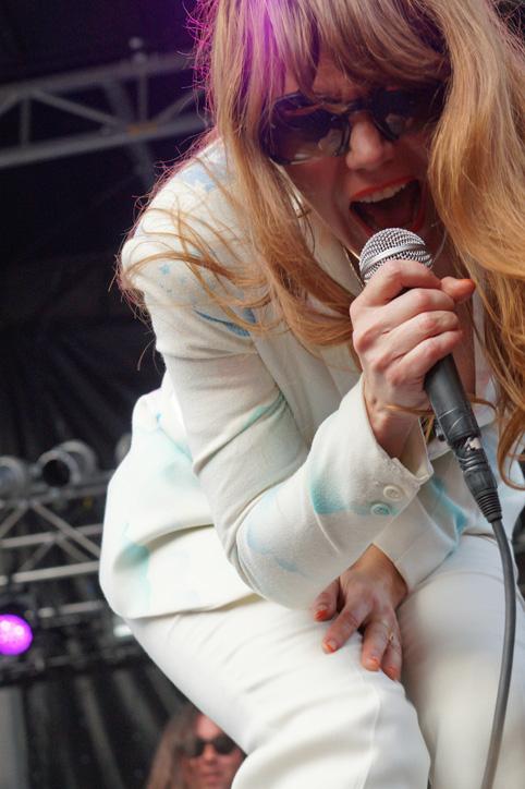  After walking around the front of the stage, lead singer Jenny Lewis takes a moment to sing out towards the right side of the crowd. Lewis was originally in the band Rilo Kelly until the split in 2011.