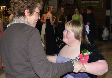 Sophomore Erin Gardner and her mom dance together at prom.