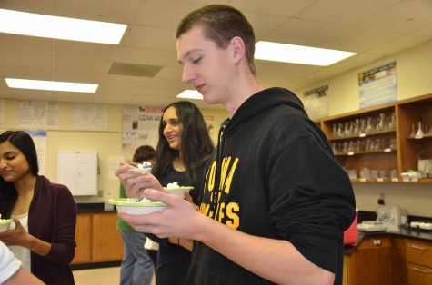 Junior Alec Kuehn tries the ice cream made in the lab.
