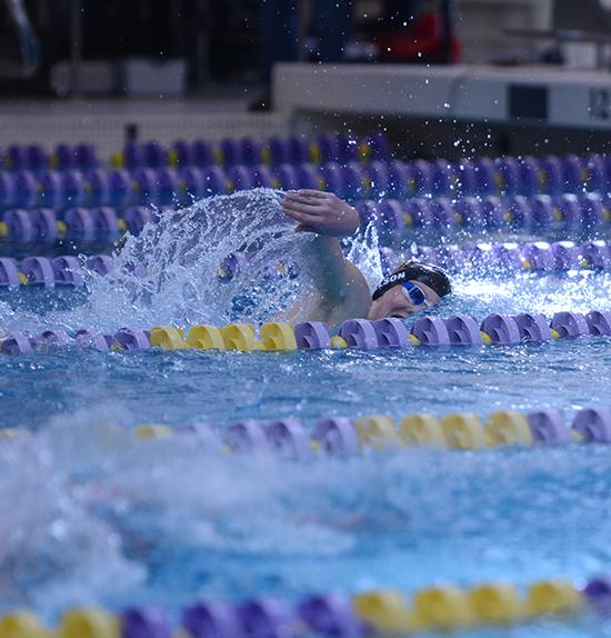 Freshman Grant Nelson competes in the 500 yard freestyle. The boys placed fifth overall at the state on Feb. 13. 