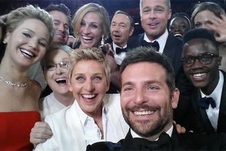 Actor Bradely Cooper snaps a selfie during the Academy Awards.