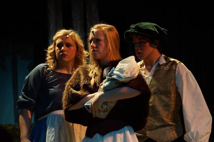 Sophomore Kennedy Kramer, Cinderella, junior Autumn Askew, Red Riding Hood and junior Kameron DeMoss, Jack, look stern as they disagree with the witch (not shown) on her next plan of action. Into the Woods was a mash-up of a lot of different fairy tales, like Cinderella, Snow White, Red Riding Hood, Jack and the Bean Stalk, Rapunzel and more. The musical was held the weekend of April 25-27.