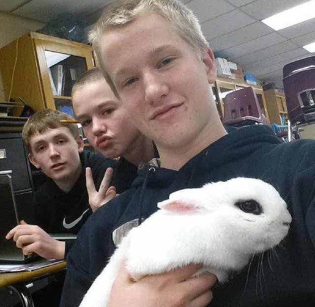 Howie poses with Adam Stiles while in his animal science class.