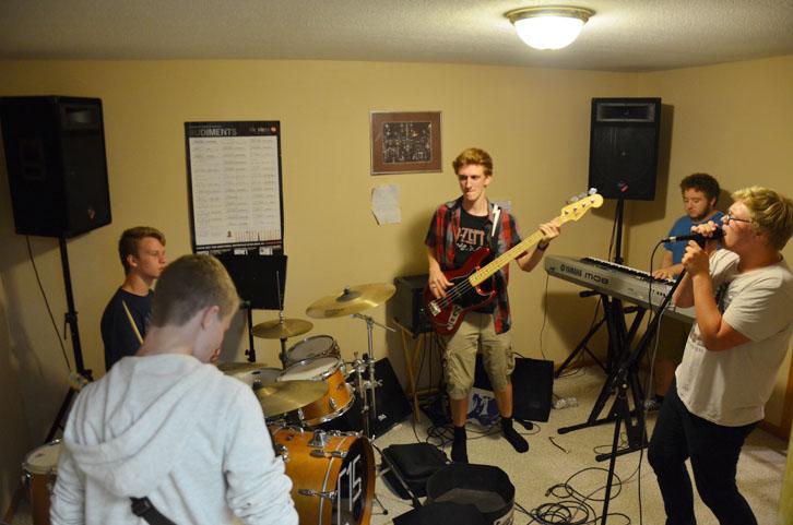 Band 515 rehearses newly written material at their makeshift practice room. Once finished recording in Norwalk, 515 plans on releasing more music in the future.