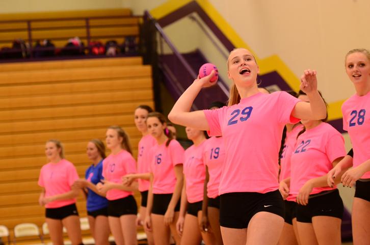 Senior Kristen Stucker throws a ball to the crowd at senior night against Dowling Catholic Oct. 14. Stucker will be attending Austin Peay State University to play volleyball after high school. 