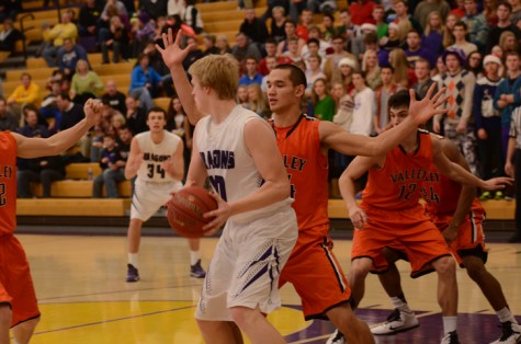 Number 44 from the West Des Moines Valley Tigers boys' basketball team guards senior Regen Siems.