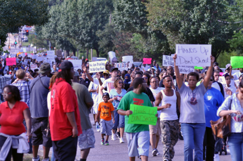Citizens of Ferguson, MO march down West Florissant Ave. in protest of the death of Michael Brown.