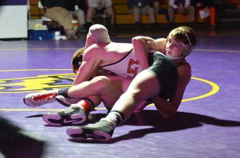 Senior Shane Vaughn takes down Valley wrestler Todd Robinson at 138 pounds during the home meet Jan. 22. Vaughn went on to pin Robinson, helping the Dragons to take the lead. However, the Tigers preceded to take the meet, winning 34-31.