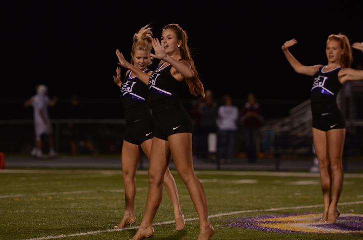 Seniors Karli Killian and Alex Reiher perform at the home football game against Ankeny at half-time. 