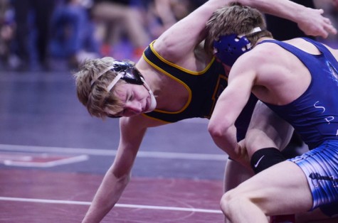 Senior Henry Pohlmeyer wrestles his quarterfinal opponent, Spencer Nevills from Pleasant Valley. Pohlmeyer lost this match 3-0, as well as his consolation match, eliminating him from the tournament.