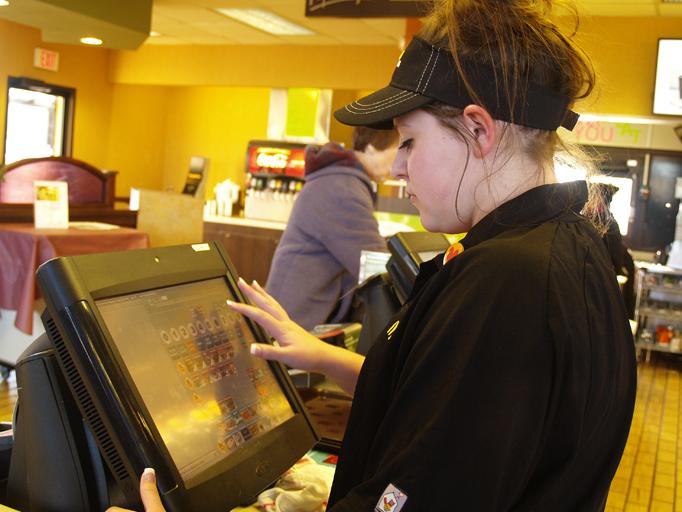 Sophomore Melodee Sokol creates an order for a customer at the McDonalds on 86th Street. Sokol was able to watch someone pay with lovin during the McDonalds campaign Feb. 2-14.