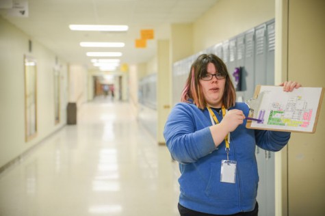 Senior Eilise Murray looks at the schedule to make sure she collects recycling from the correct rooms. Every Wednesday students within the special education department collected recycling from each room in the high school.