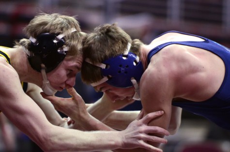 Senior Henry Pohlmeyer (132) wrestles with Pleasant Valley's Spencer Nevills during the quarterfinal match Feb. 20. Pohlmeyer lost 3-0 and will wrestle in the consolation round shortly after the 2A quarterfinals.