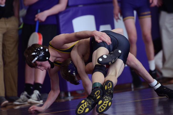 Jakob Allison from Waukee High School attempts to get a reversal on freshman Zach Price during the district championship on Feb. 14. Price preceded to stop the reversal, however he eventually lost the match, placing second in the district. Price will be competing in the state championships at 106 pounds Feb. 19-21 at Wells Fargo Arena.