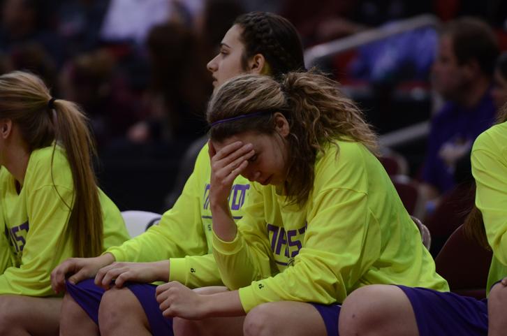 Sophomore Madelyn Hurn holds her head in disappointment as Dowling takes the lead and advances to the semifinals. The girls played Dowling Catholic and lost 58-52, eliminating them from the tournament.