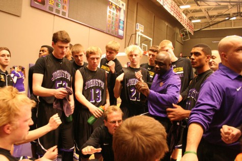 Discussing plays and tactics during a second half timeout, senior Reid Sinnett, juniors Jared Bacon, Erik Francois, coach Billy Proctor and sophomore Jeran Proctor huddle and shortly resume the game.
