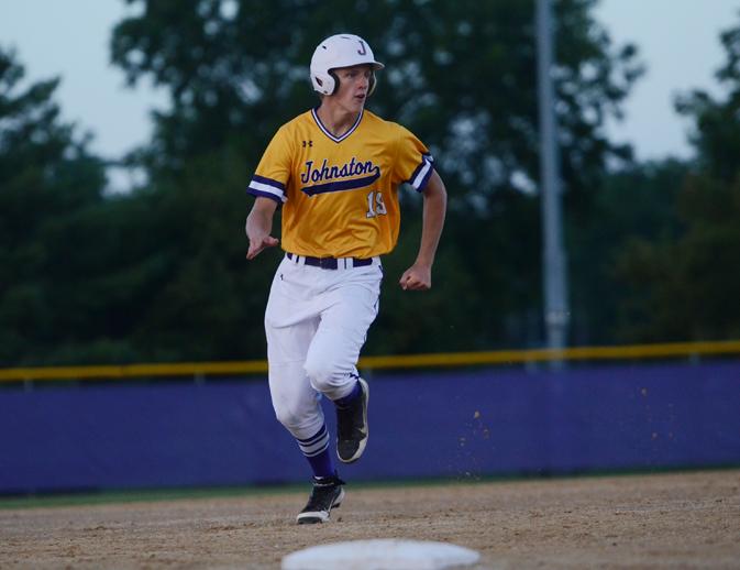 Junior Drew Dotseth dashes down the baseline and then successfully slides towards home base with a safe finish. The boys varsity baseball game against North was held July 17.