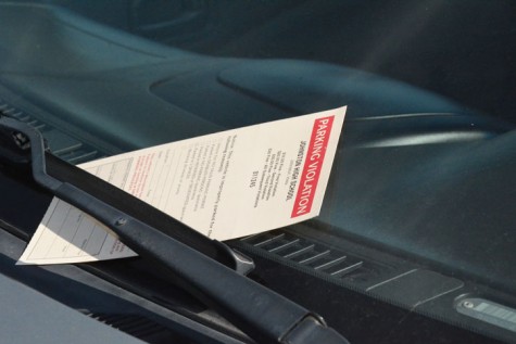 The ticket is placed between the windshield and windshield wipers to signal the student they received a parking ticket. The fee starts at $10 then progresses up to $30.