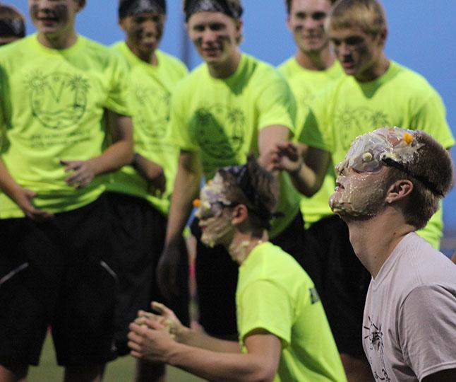 Senior Johnny Holdsworth prepares for the launching of cheese balls towards his face during the challenge pudding face. Rock Around the Clock took place Sept. 28 starting at 6:45 p.m.