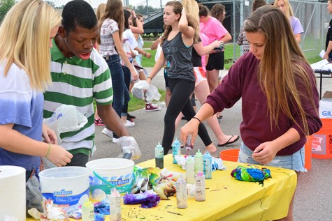 Junior Lauren Bellis helps her new best buddy Meshak Ntambwe along side of junior Breyenne Beierle. The next event held by Best Buddies is the RATC tailgate which will take place before RATC at 5:45 p.m. Sept. 28. 
