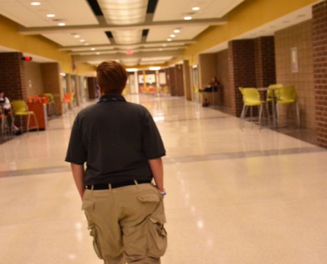 Erin Kohlsdorf, the new school security officer, patrols the hallways of the school. She looks forward to forming relationships with the students and staff through her job.