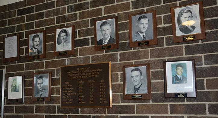 This is the wall of Fallen Soldiers consisting of six photos of soldiers from World War II. It is located in the front entrance of the high school between the doors.