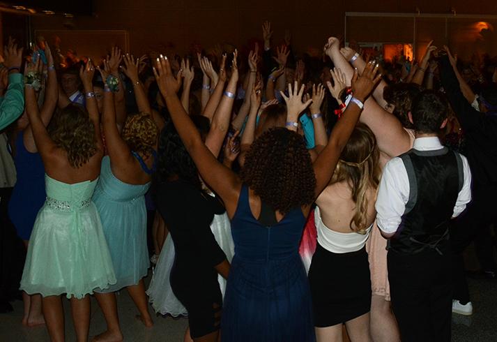 Homecoming attendees put their hands up in the air during the song All I Do Is Win by DJ Khaled. The dance was held at Summit Middle School Oct. 3 starting at 8 p.m.
