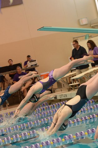 Junior Lexi Horner dives into the water for the 100 yard breaststroke at the Johnston Invitational Oct. 10. She placed first in the event with a time of 1:07.47 minutes, Horner has broken multiple school records and obtained all 14 honor times.