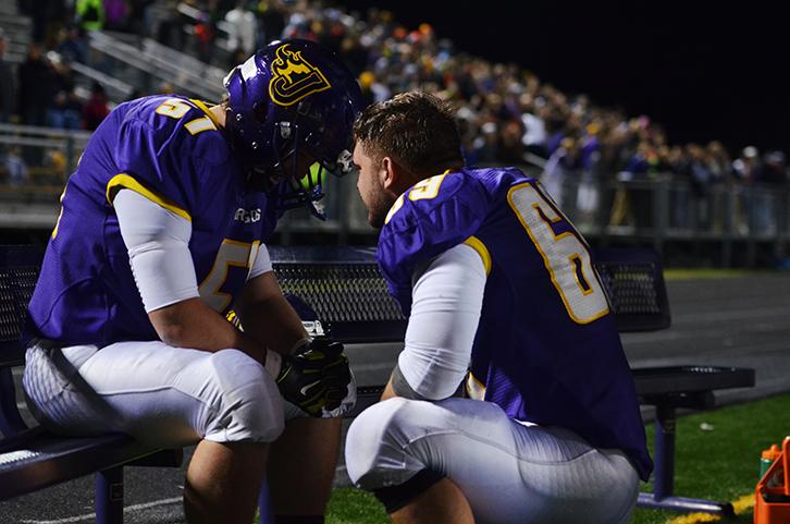 After the Tigers had scored bringing them up 20-17 senior Boris Petrusic looks up at his teammate and good friend senior Dino Dupanovic. Petrusic spoke with Dupanovic one on one during the last minute of the game. The varsity football played the third playoff game against the Valley Tigers Nov. 6.  