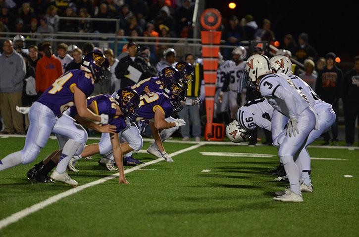 The Dragons defensive line rushes to tackle Valley Tigers offensive line during the final round of State playoffs Nov. 6. The Dragons lost to the Tigers 20-17. 