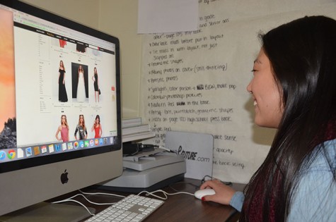 Senior Makenzie Hill scrolls through just a few of the hundreds of dresses sold online from Lulus.com. Websites similar to Lulu's that sell an assortment women's clothing are becoming more popular in today's era of cyber shopping.