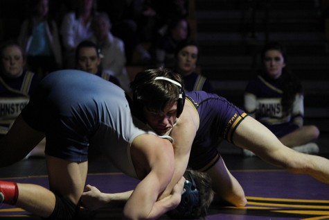 Senior Blake Anderson attempts to take down an opponent. Anderson currently wrestles for the varsity team in the 113 weight class.
