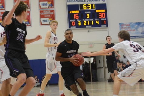 Junior Jeran Proctor drives through the Urbandale defense to the basket. The Dragons defeated the Jayhawks Jan. 29.