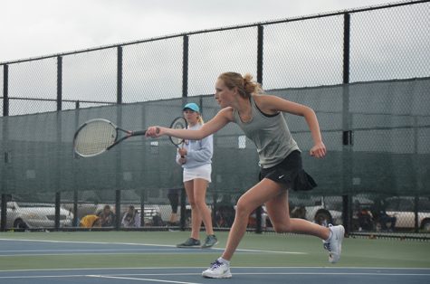 As a light rain began to pick up junior Emma Heiser goes after the ball. The team won 10-1 against the SE Polk Rams April 28.