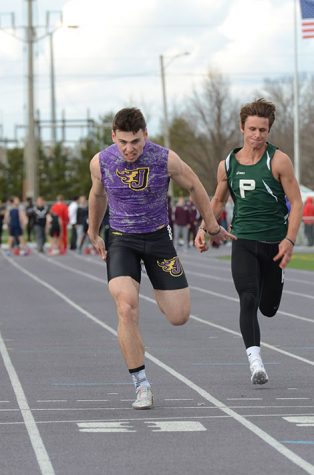 Junior Jonny Pater finishes the 100m sprint. Pater placed 13th in the 100m sprint at the state track meet May 19.