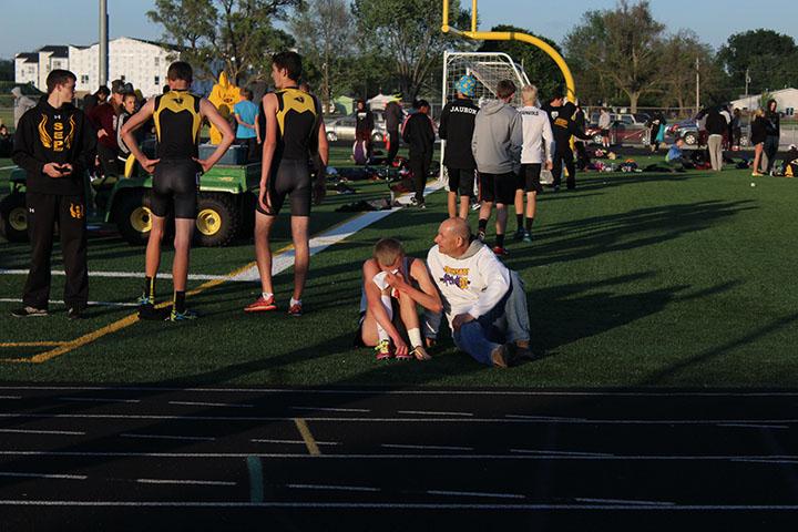 Due to an injury sustained perviously in the week, senior Zach Smith reacts to not qualify for the 1600 m run at the district meet May 16. Smith however did compete in the 3200 m run at state and finished with a time of 9:58.81, placing 16 overall. 