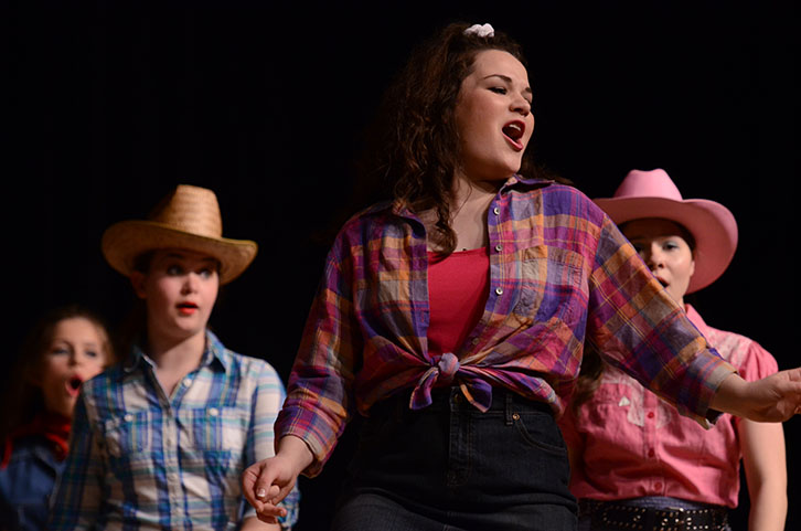 Senior Hannah Miedema, who played Rusty Rodriguez in Footloose, belts out a song during the Friday night performance. Miedema also received a recognition for an outstanding performance in a leading role. 