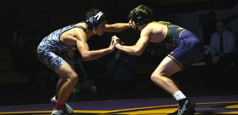 Cade Moss '19, wrestles Roosevelt opponent Jacob Senna '20. Moss won his match with a pin.