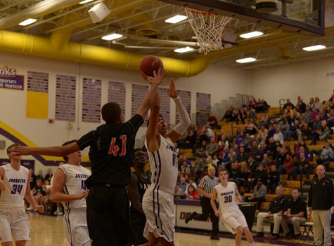 Jaden Kephart 17 goes for a lay-up against an Ames opponent. The Dragons lost to Ames 55-48 Dec 2.