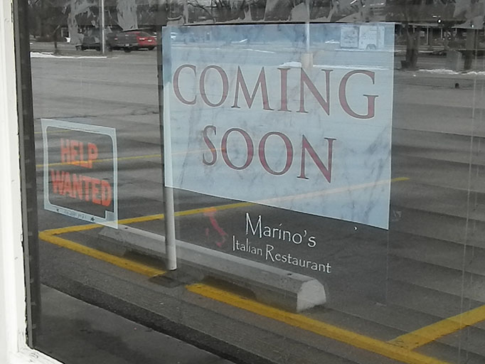 A coming soon sign hangs in the window of the soon-to-be Marinos Italain Restaurant. The venue was previously Encore Pizza, before closing unexpectedly.
