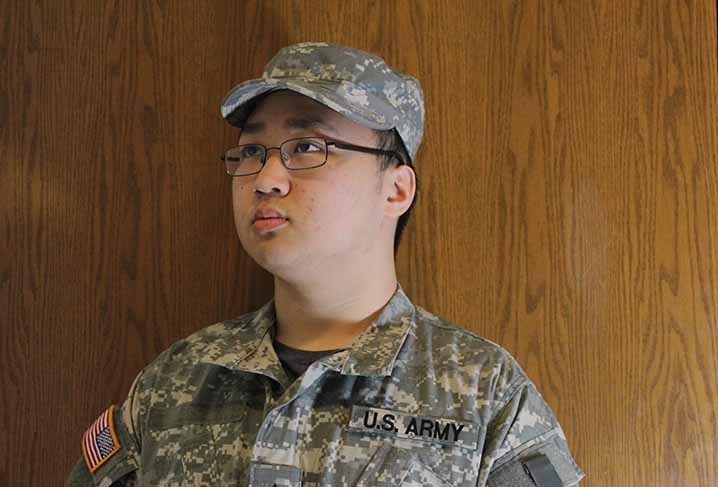 Alvin Chen 18 poses for a picture in his National Guard uniform. Chen is focusing on a business career with the military being a plan B.