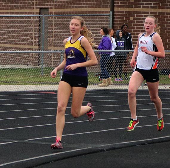 Jessica Mckee 18, pulls away from her opponent in the 3000m race. The girls track team competed at home on March 28. 